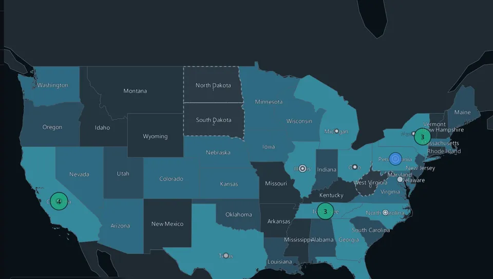 A dark map of the United States, states shaded by how much was reported there, with markers where stories cluster.
